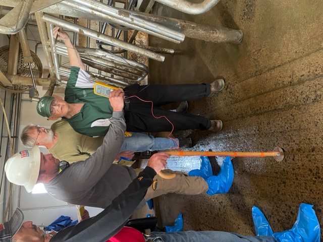 Taking readings from the milking parlor.